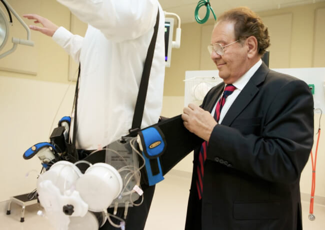 Image of Dr gura testing his patient with testing equipment