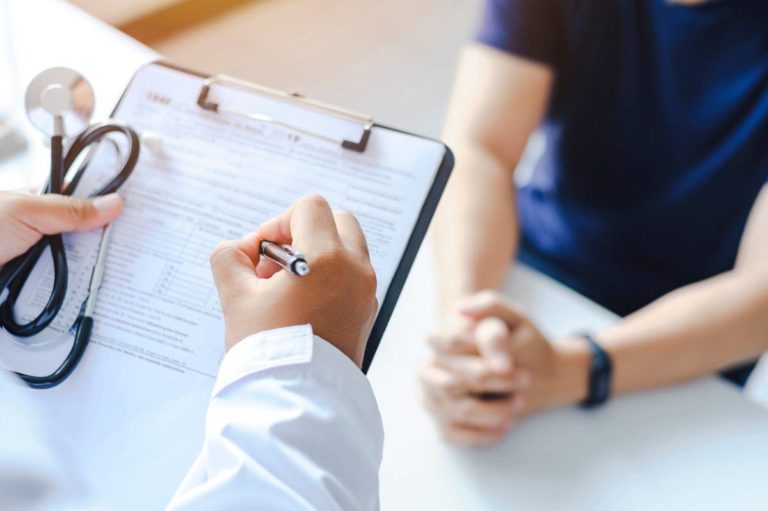 Patient consulting a doctor stock image